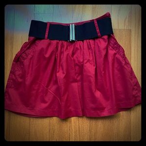 Red cotton mini skirt.